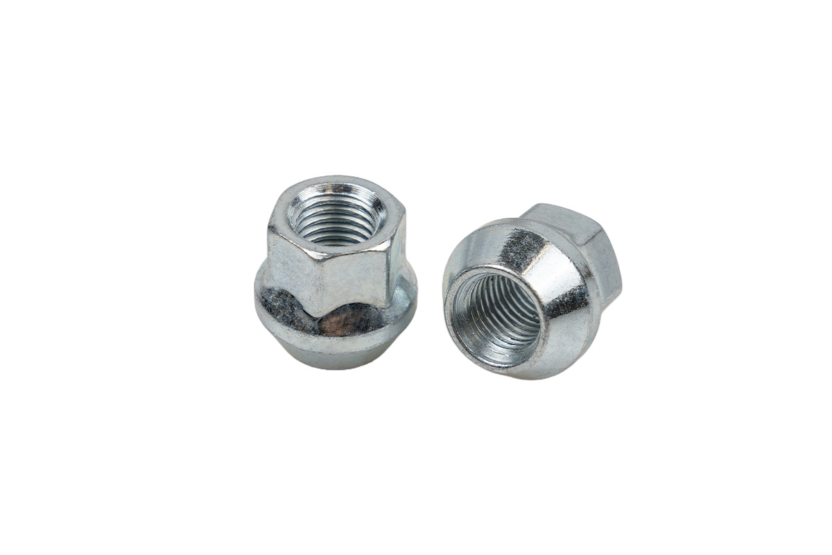 Nakrętki Stal M12x1,5 21mm Stożek kl.17 przelotowa